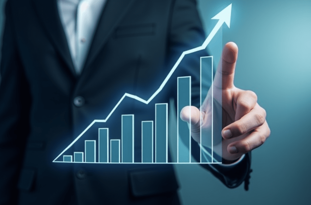 Persona en traje señalando un gráfico ascendente digital, representando las Tendencias en formación profesional 2025 cursos demandados